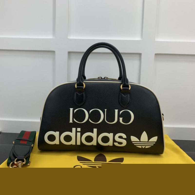 G*u*i top handle bags
